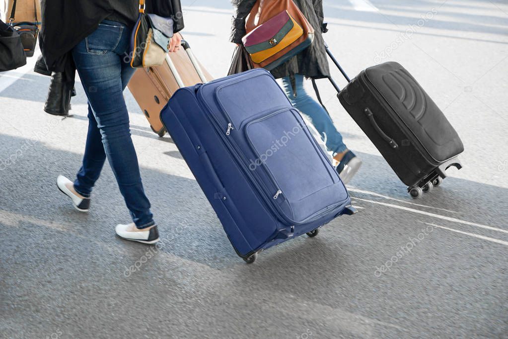 Women carrying suitcases 