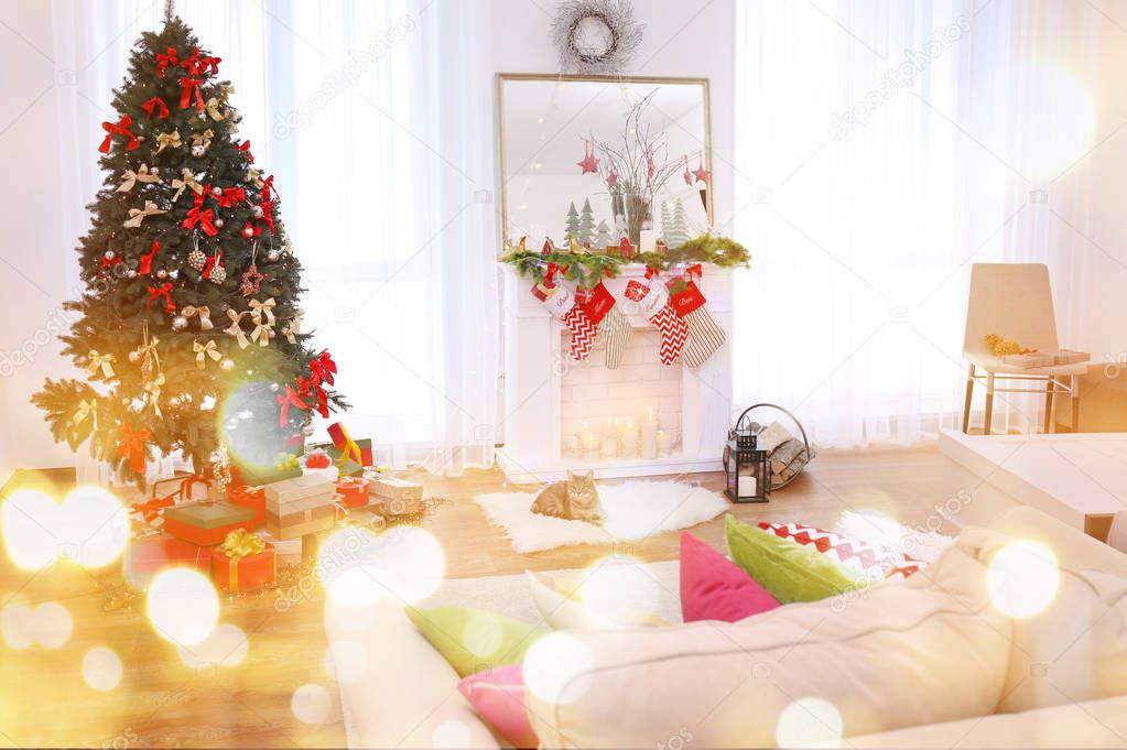 Interior of cozy living room decorated for Christmas. Festive and blurred lights design. Celebration of new year 2018