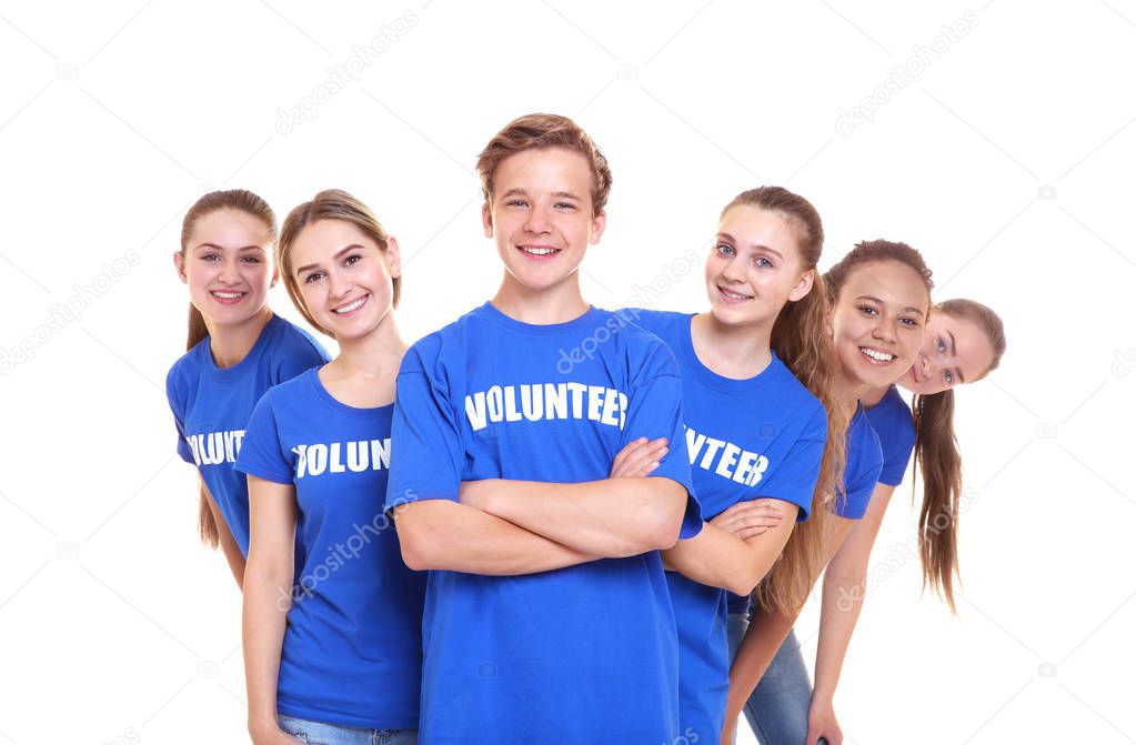 Group of young volunteers on white background
