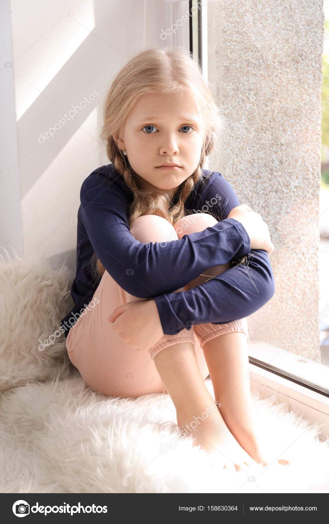 Cute sad girl Stock Photo by ©belchonock 158630364