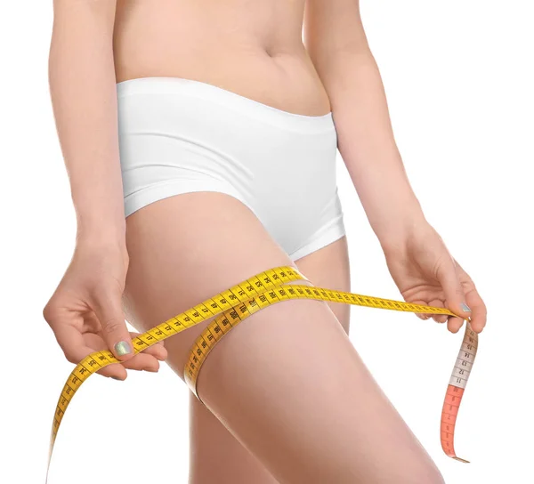 Woman in underwear with measuring tape — Stock Photo, Image