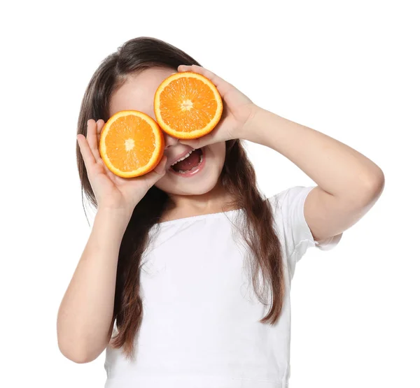 Cute little girl with halves of orange — Stock Photo, Image