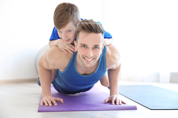 Dad and son in gym