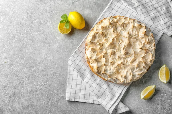 Composition with tasty lemon meringue pie on grey table — Stock Photo, Image