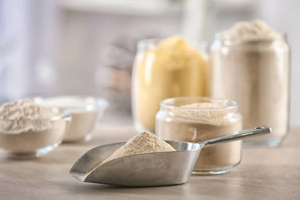 Metal scoop with flour — Stock Photo, Image