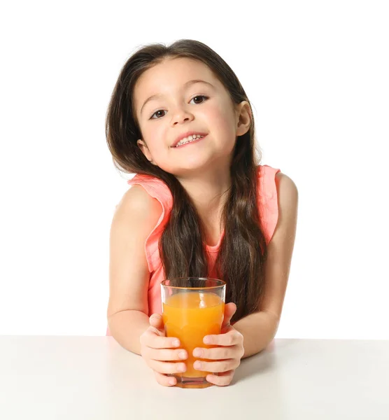 Cute little girl with glass of juice — Stock Photo, Image