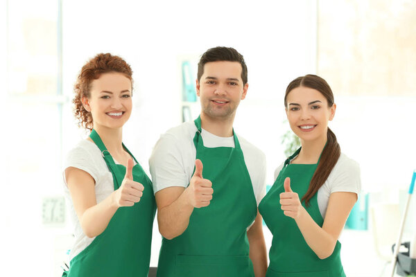 Cleaning service team at work in office