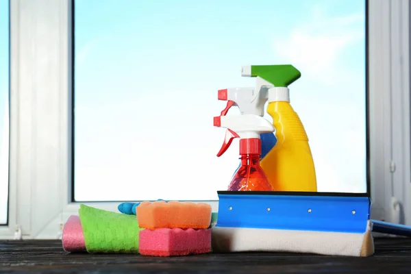 Cleaning supplies on window sill