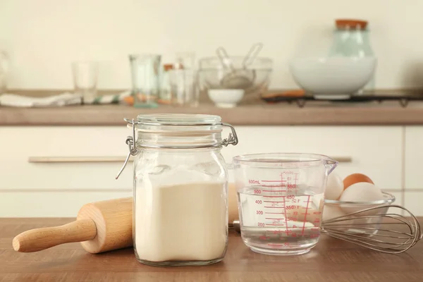 Flour in jar and ingredients — Stock Photo, Image