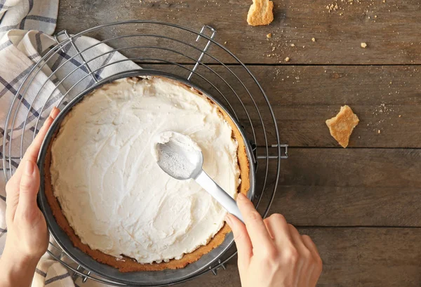 Woman preparing cheese cake