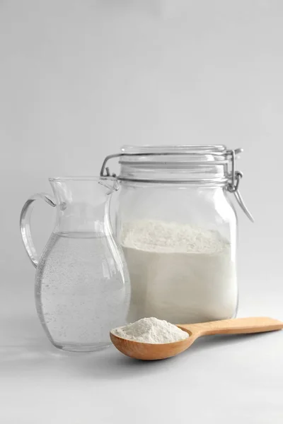 Flour and water in jar — Stock Photo, Image