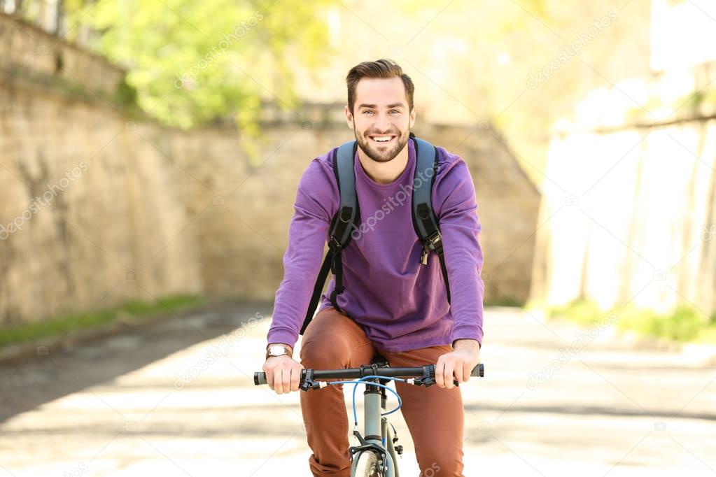  man riding bicycle