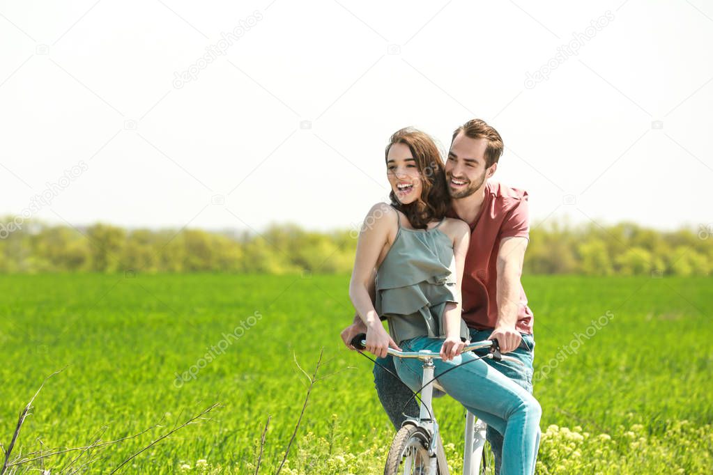 couple riding bicycle