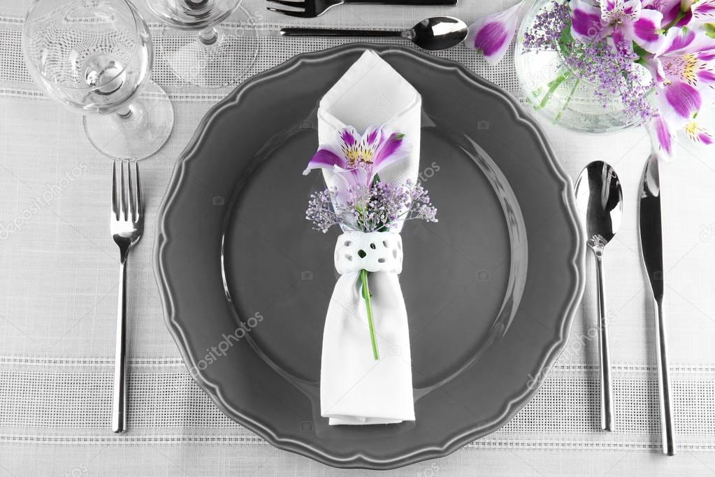 festive table setting with floral decor 