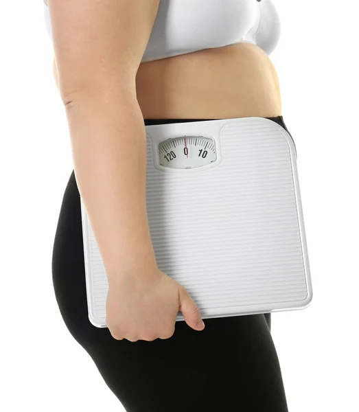 Overweight woman holding scales — Stock Photo, Image