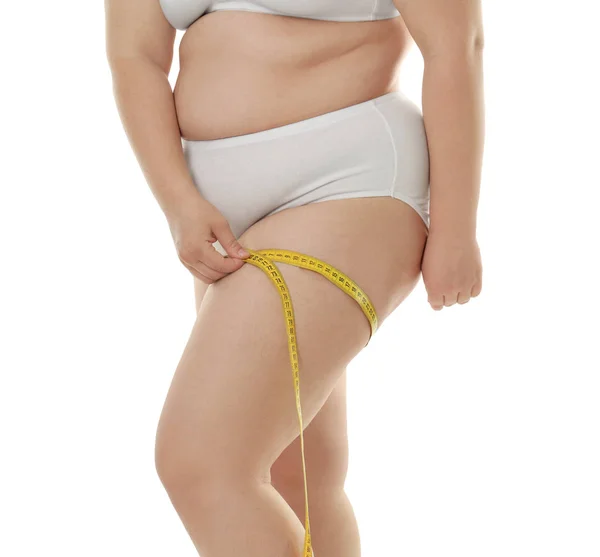 Overweight woman measuring thigh — Stock Photo, Image