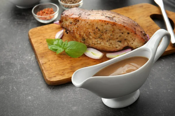 Tasty turkey gravy in sauce boat — Stock Photo, Image