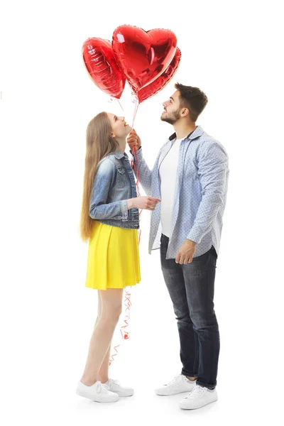 Bonito jovem casal com balões — Fotografia de Stock