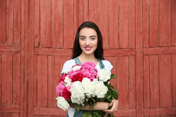 Young cheerful woman with beautiful bouquet — Stock Photo, Image