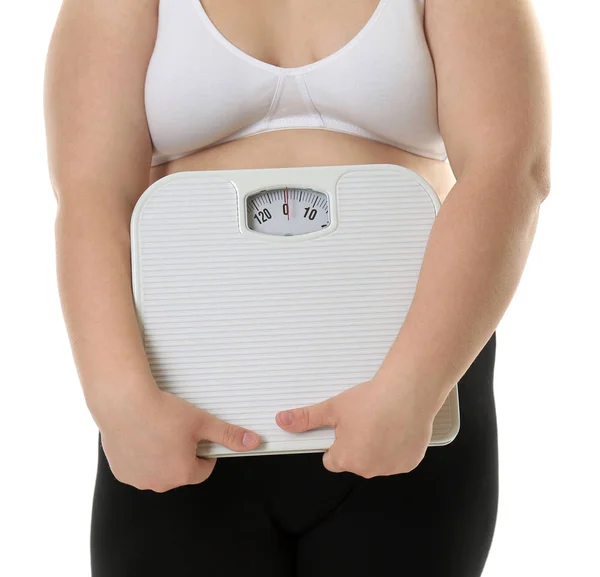 Overweight woman holding scales — Stock Photo, Image