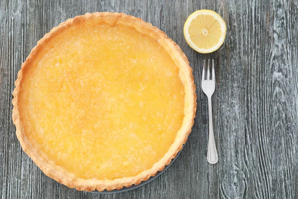 Tasty lemon pie with fork — Stock Photo, Image