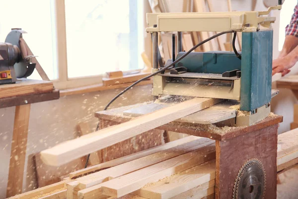 Carpenter working with grinder — Stock Photo, Image