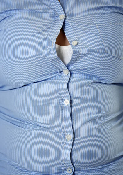 Overweight woman in tight shirt — Stock Photo, Image