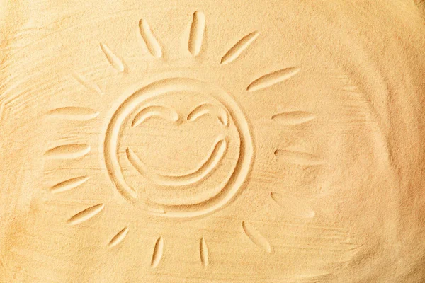 Sun drawn on sand