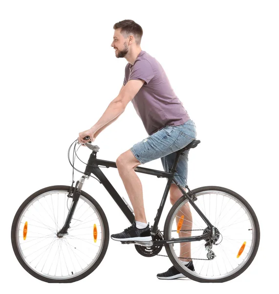 白い背景のハンサムな若い男乗って自転車 — ストック写真