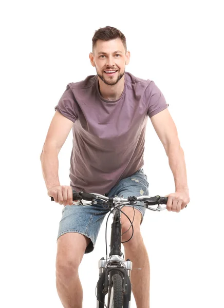 白い背景のハンサムな若い男乗って自転車 — ストック写真