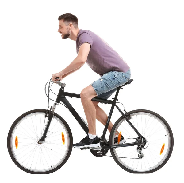 Schöner junger Mann mit Fahrrad auf weißem Hintergrund — Stockfoto