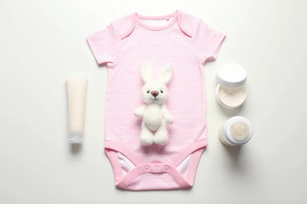 Bodysuit  and baby care accessories — Stock Photo, Image