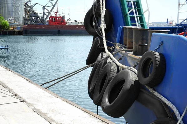 Berthed tug boat with tires