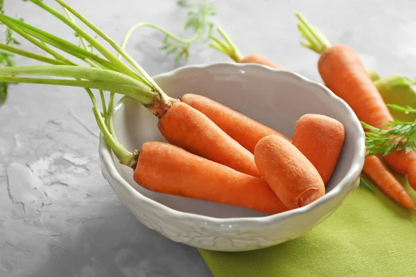 Bowl with fresh carrot — Stock Photo, Image