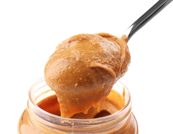 Creamy peanut butter in spoon — Stock Photo, Image