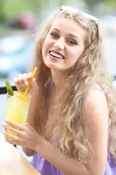 Young woman drinking tasty juice — Stock Photo, Image