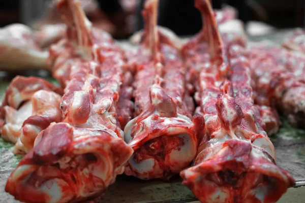 Fresh meat bones on counter — Stock Photo, Image