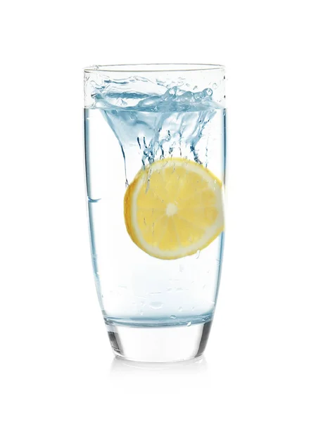 Glass of lemonade with splashing water — Stock Photo, Image