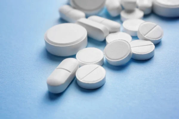 White pills on background — Stock Photo, Image