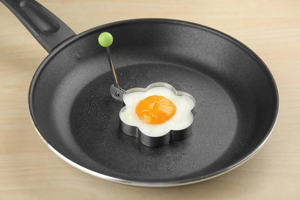 Frying pan with tasty egg