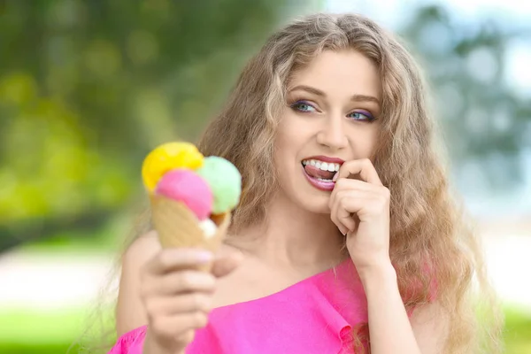 Young woman eating ice cream