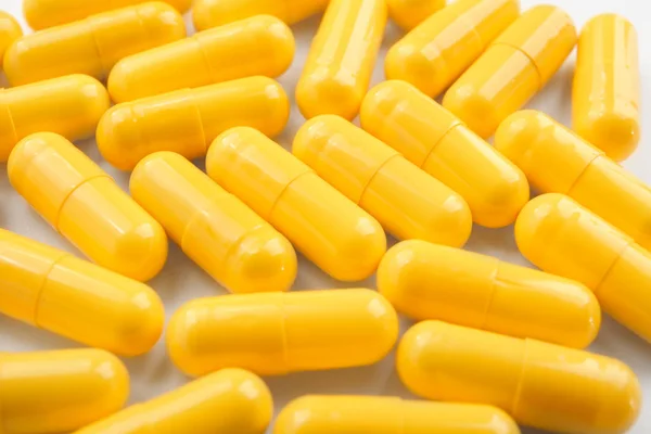 Conceito de saúde. Pílulas coloridas closeup — Fotografia de Stock