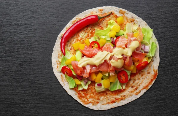 Fish taco with salmon and chili pepper