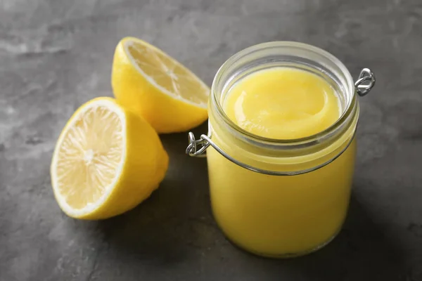 Beautiful composition with delicious lemon curd on table — Stock Photo, Image