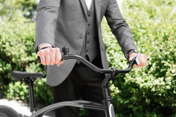 Young man with bicycle in park — Stock Photo, Image