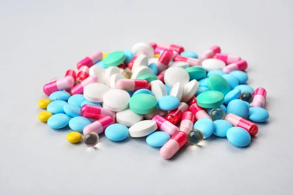 Different pills on light background — Stock Photo, Image