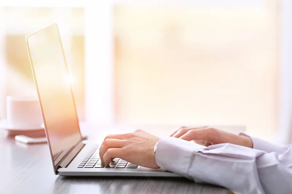 Man using laptop at work