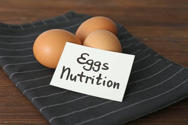 Napkin with eggs and sheet — Stock Photo, Image