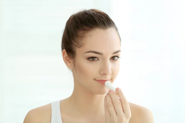 Woman applying hygienic lip balm — Stock Photo, Image