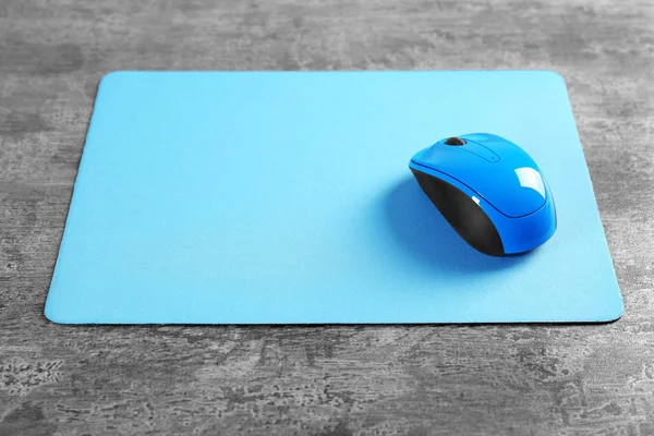 Blank mat and wireless mouse — Stock Photo, Image